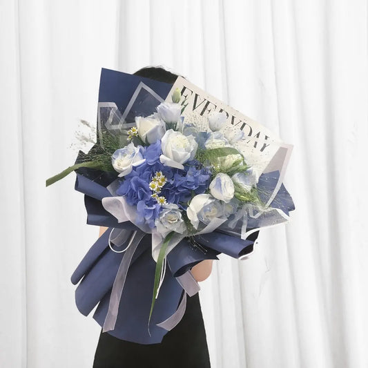 Serene white rose and blue hydrangea bouquet with small daisies and greenery in Hong Kong