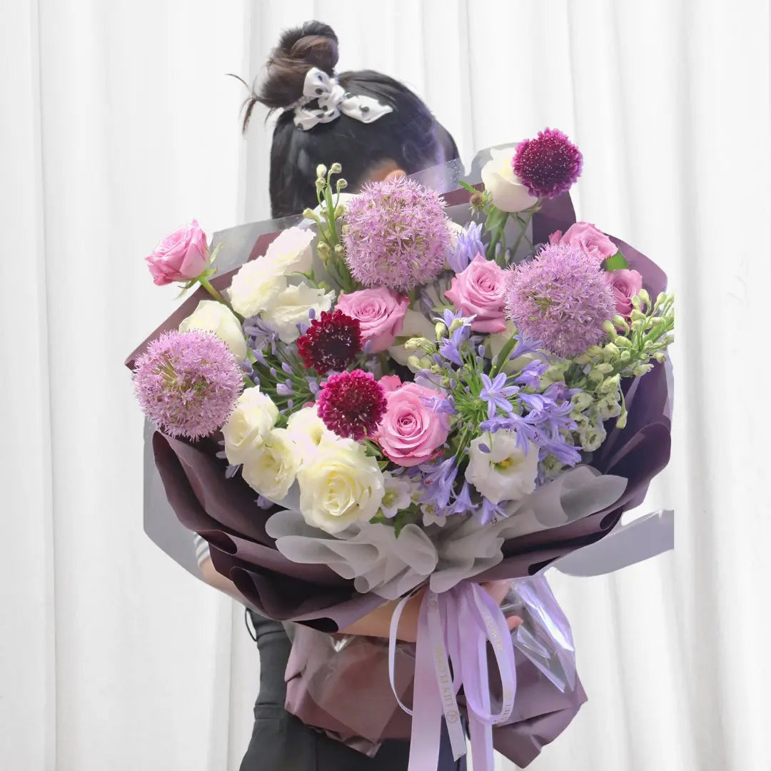 Enchanted Garden Floral Bouquet with pink and white roses, lisianthus, allium, agapanthus, and eucalyptus.