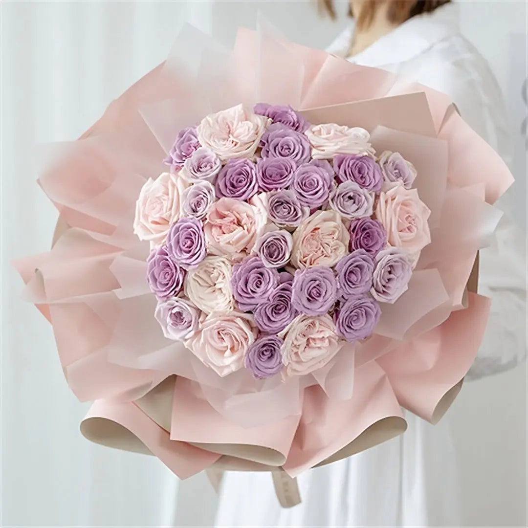 Lavender Dream Rose Bouquet with 32 light pink and lavender roses, wrapped in pink and cream tissue paper for delivery in Hong Kong.