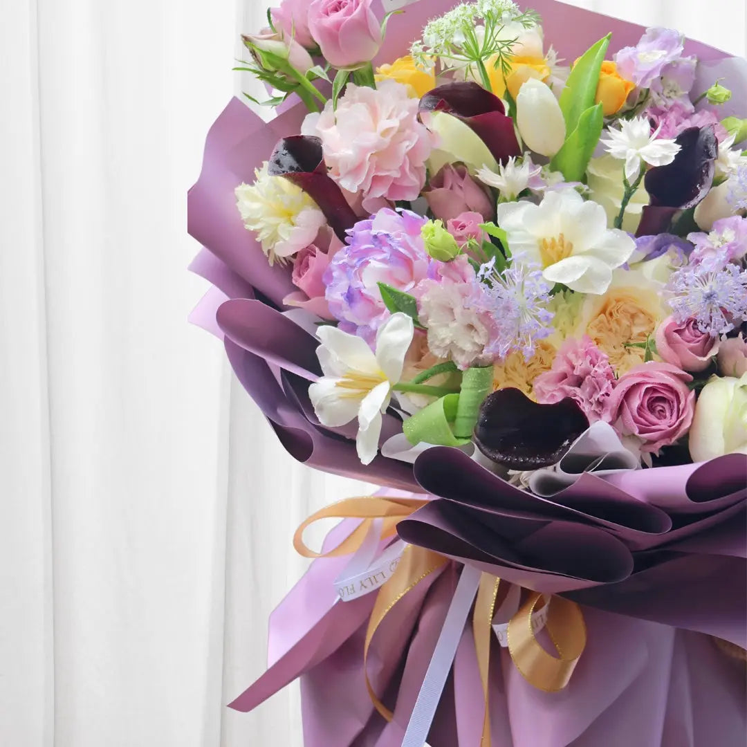 Luxurious bouquet with roses, peonies, lilies, and carnations in soft pink and lavender hues  perfect for any celebration in Hong Kong.