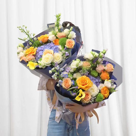 Sunset Dream Bouquet with roses, hydrangeas, and calla lilies - vibrant floral arrangement