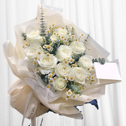 Bouquet of 12 white roses, Baby’s Breath and fresh eucalyptus leaves.